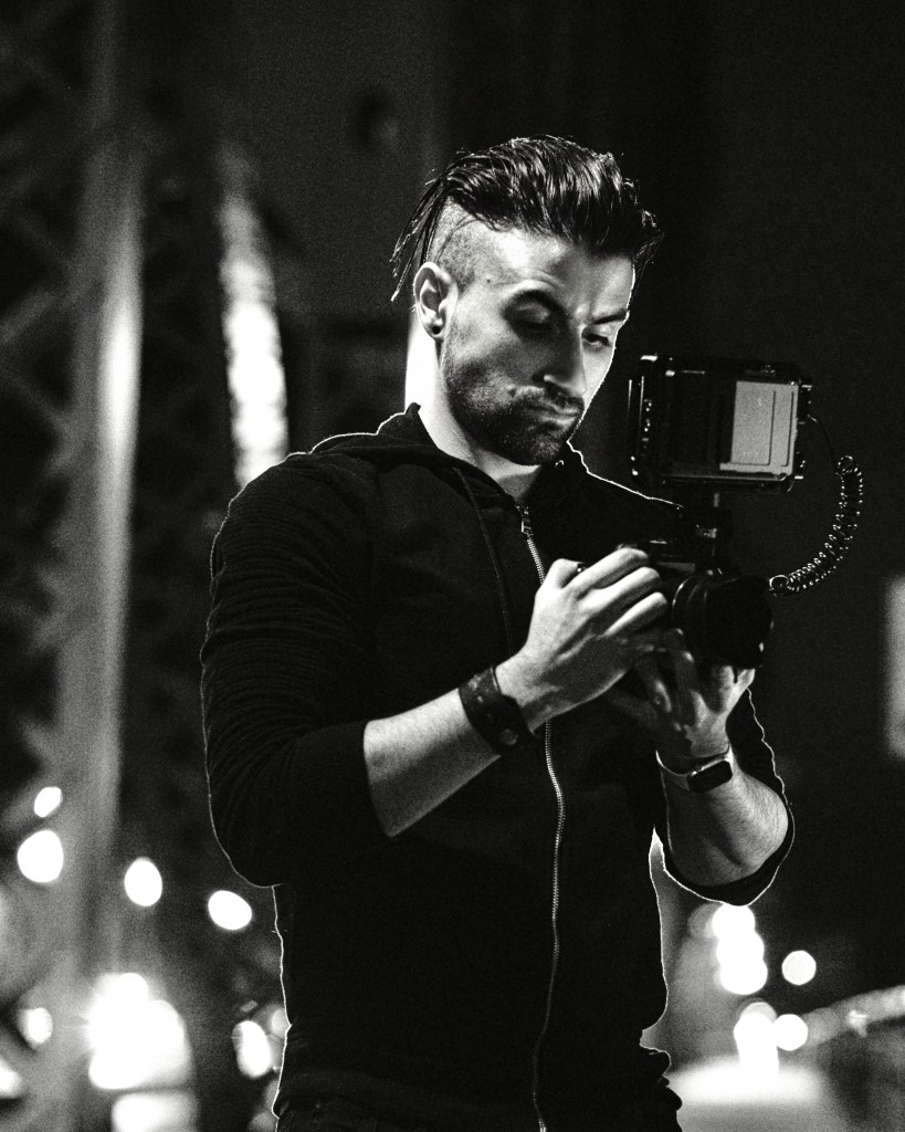 Austin Hodaie operating a cinema camera.
